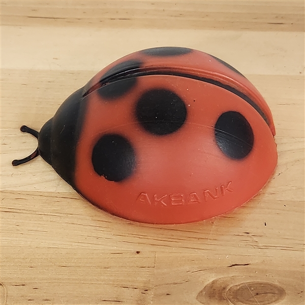 Plastic blow-mold ladybug with "AKBANK" marked on the side