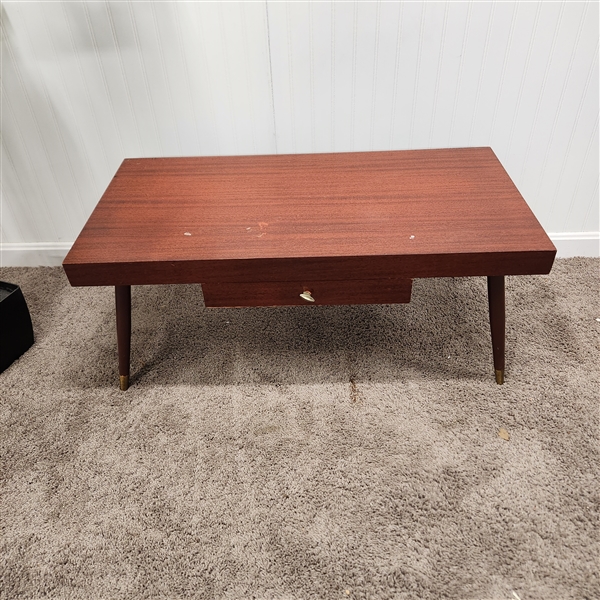 MCM coffee table with brass-capped tapered legs and drawer