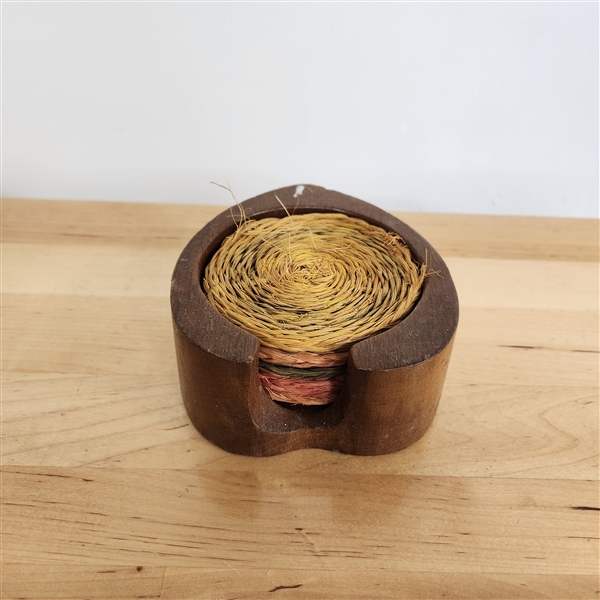 Handwoven grass coasters with wooden leaf-shaped holder