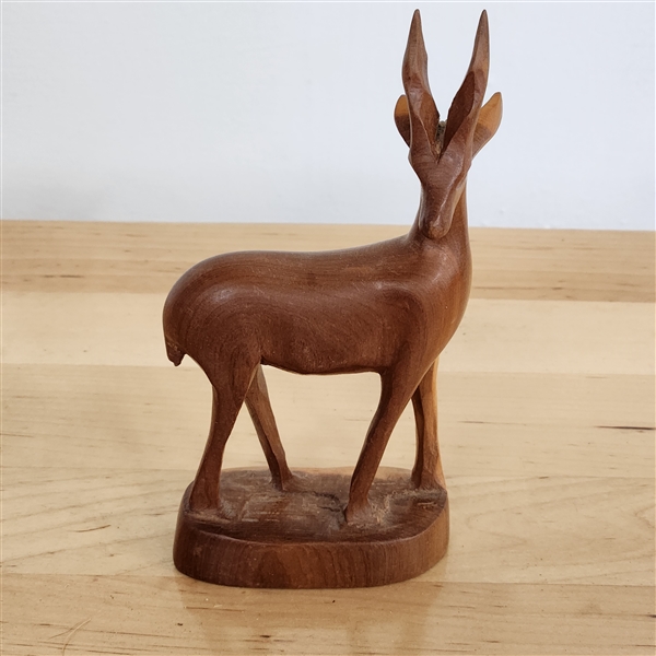 Carved wooden antelope figurine